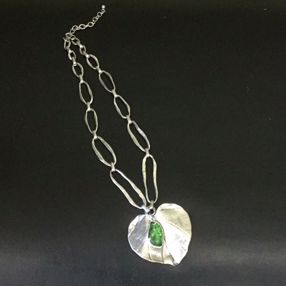 Necklace Silver Metal with hanging green accent .